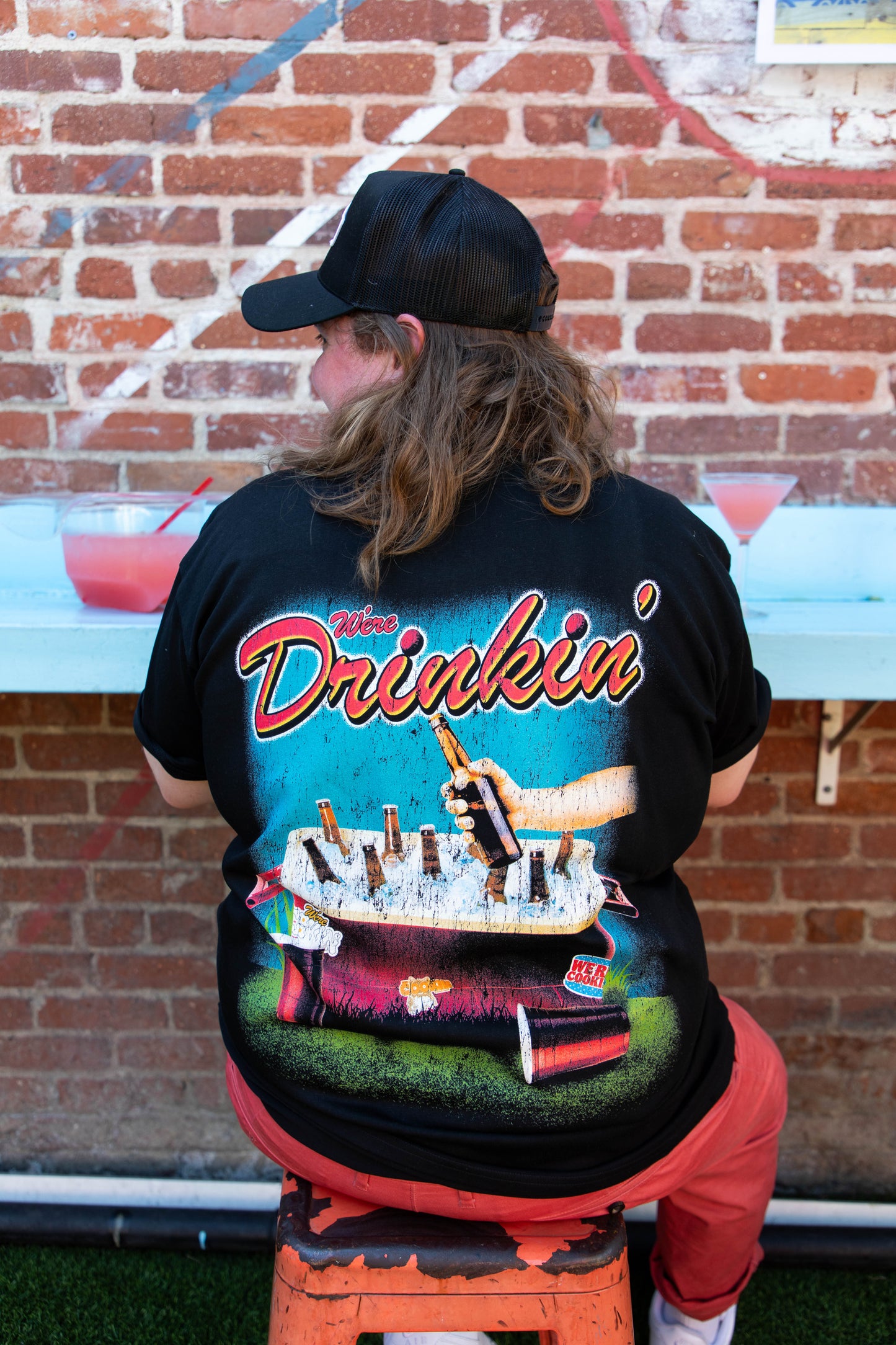 We're Drinkin' Pocket Tee