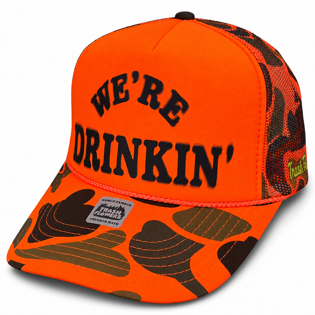 We're Drinkin' Camo Trucker Hat